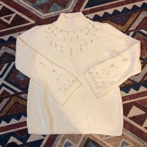 White sweater with rhinestones